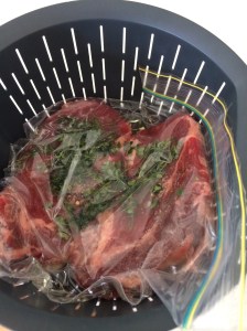 Steaks with thyme and olive oil in snap-lock bag